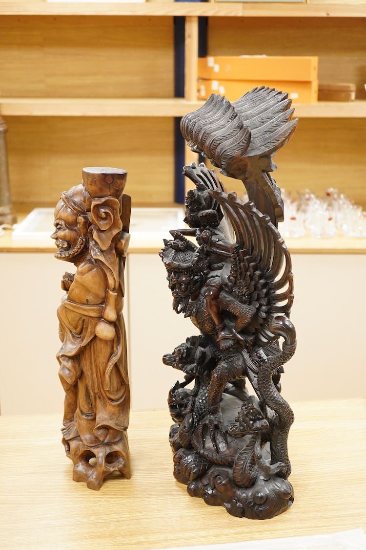 A large Indonesian hardwood Garuda group and a Chinese hardwood figure of a Luohan, largest 61cm high